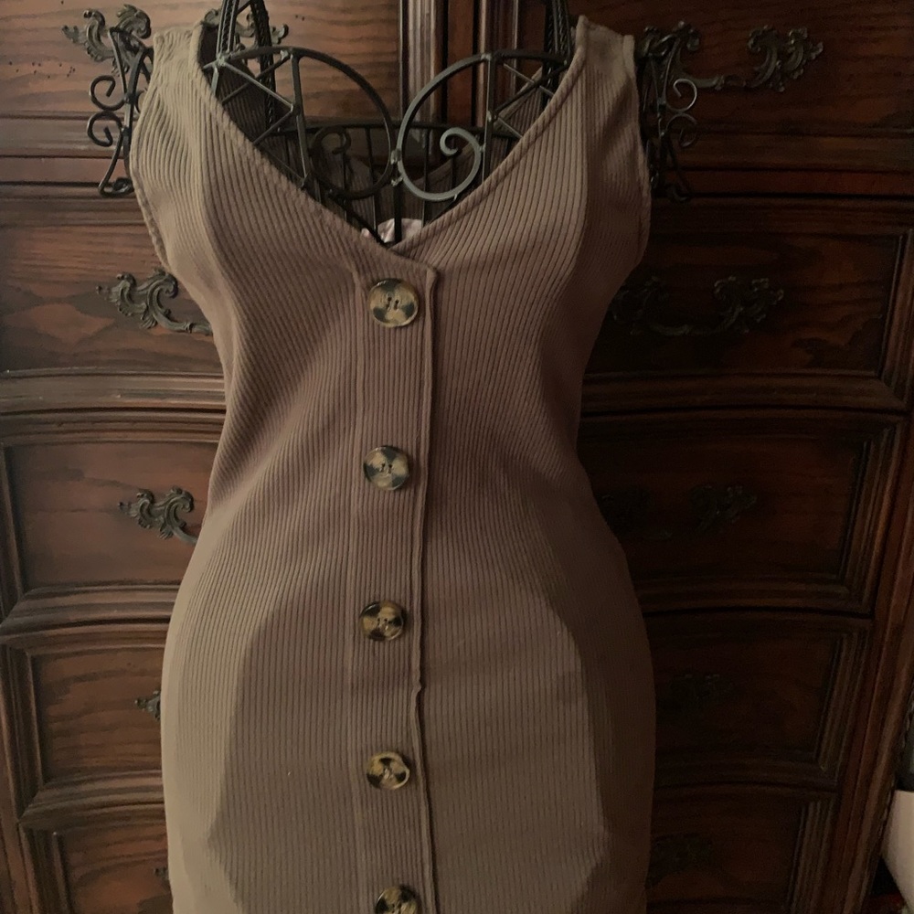 Green dress with tiger eyes style buttons
